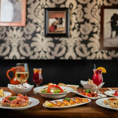 Various food and drinks on the table.