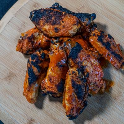 wooden board with Baffalo wings, top view.