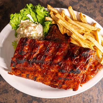 Baby Back Ribs, served with coleslaw, baked beans, and fries.
