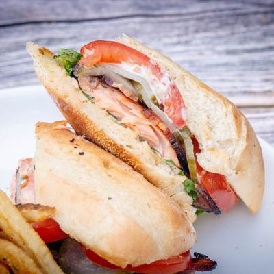 Grilled salmon BLT, close up.