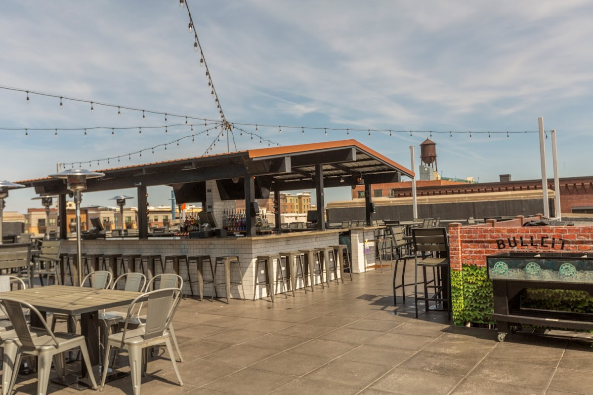 Exterior, patio seating and the bar