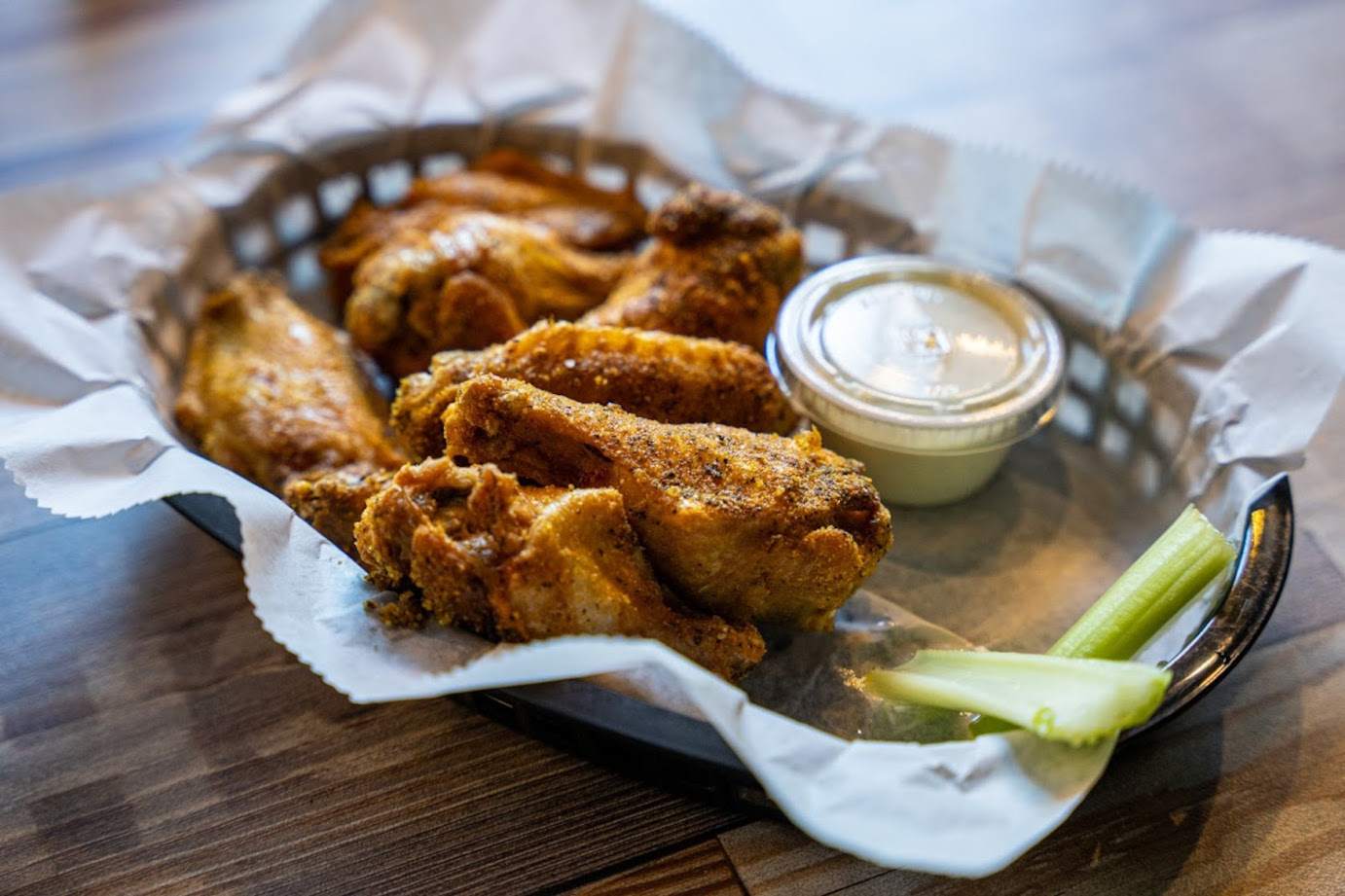 Chicken wings, served with sauce dip and celery