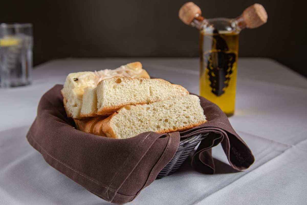 Focaccia Bread basket and olive oil cruet on a table