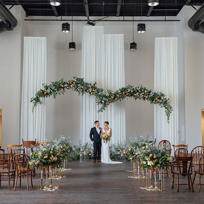 A couple posing in a wedding hall