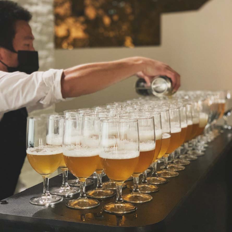 A bartender pouring beer