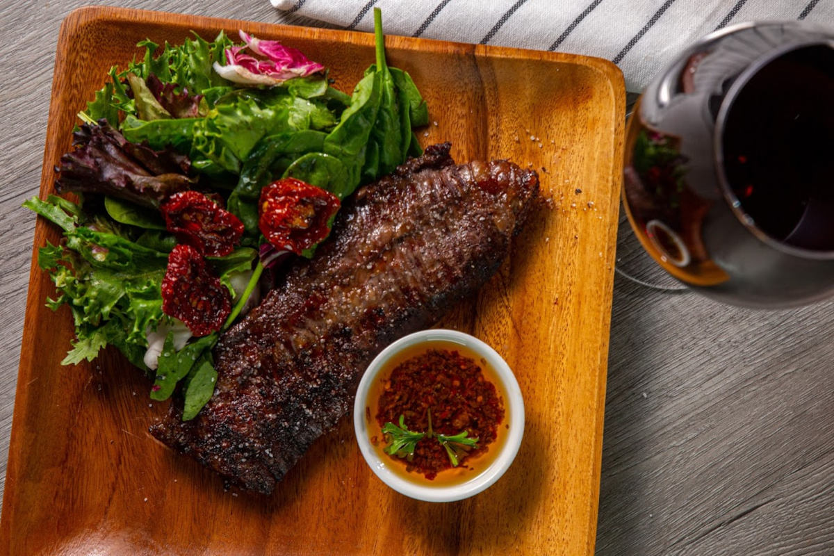 Grilled meat, mixed salad and spices