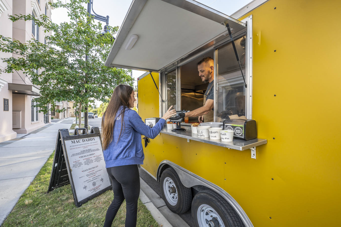 Employee serving food to a customer