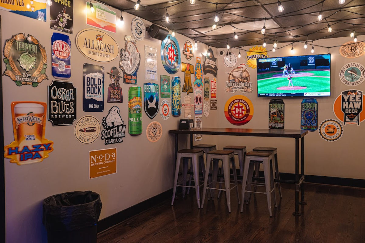 Interior, seating, TV and beer stickers on walls