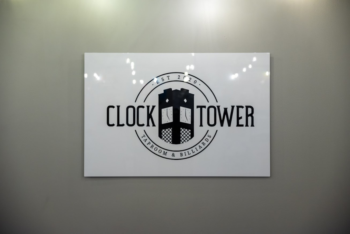 Clock Tower logo sign on a wall