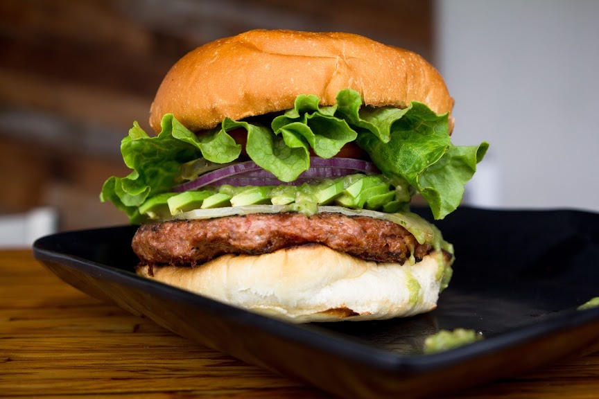 Burger with green salad closeup