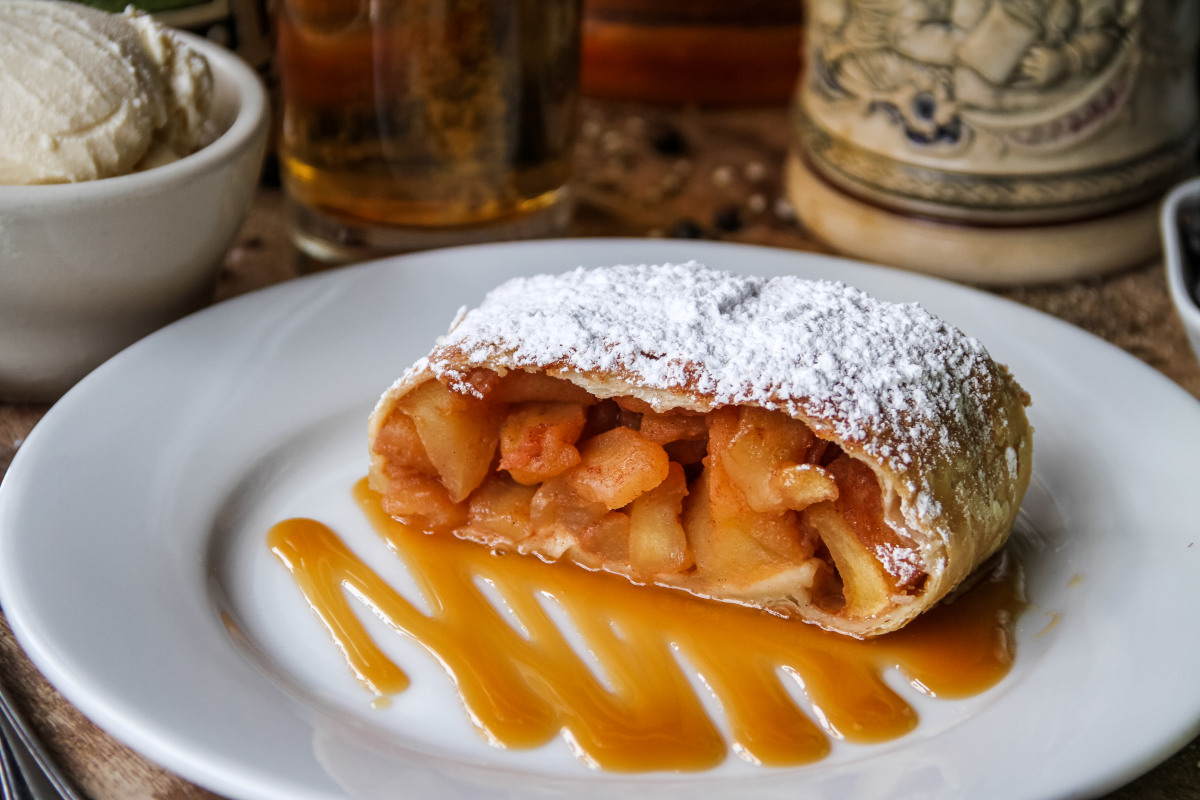 Apple stuffed pastry with caramel sauce