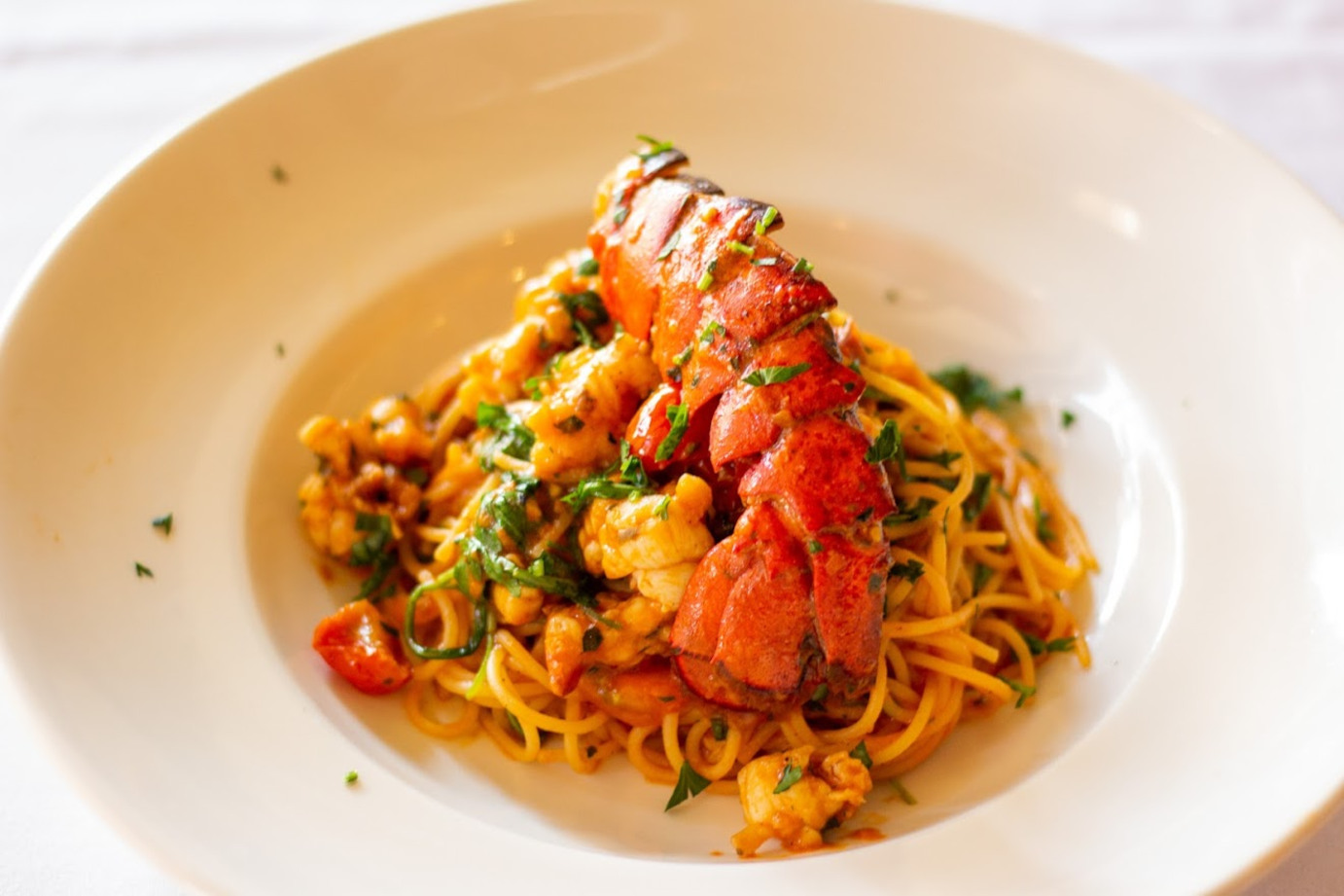 Spaghetti with lobster and parsley on top