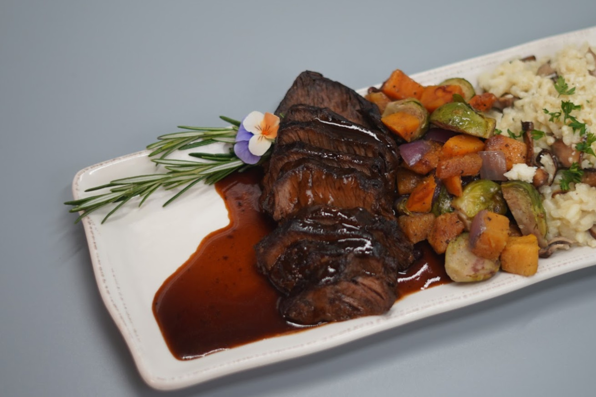 a plate topped with meat and vegetables