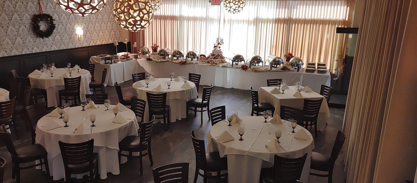 Banquet room with set catering and dining tables