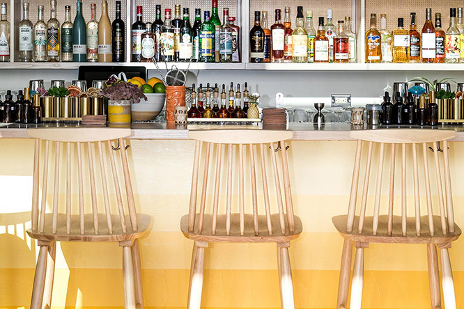 Bar with drinks and chairs