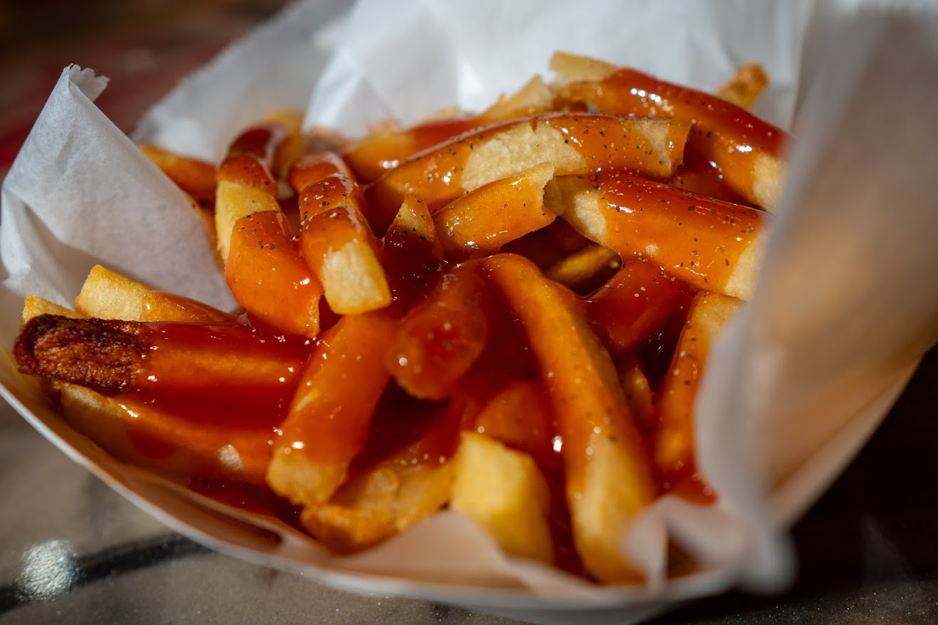 Fries with ketchup on top