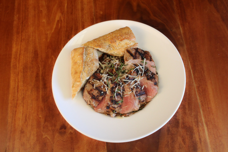 Grilled meat and rolled sliced pastry on the side