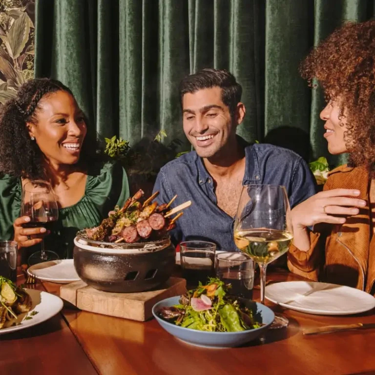 Friends enjoying food and drinks