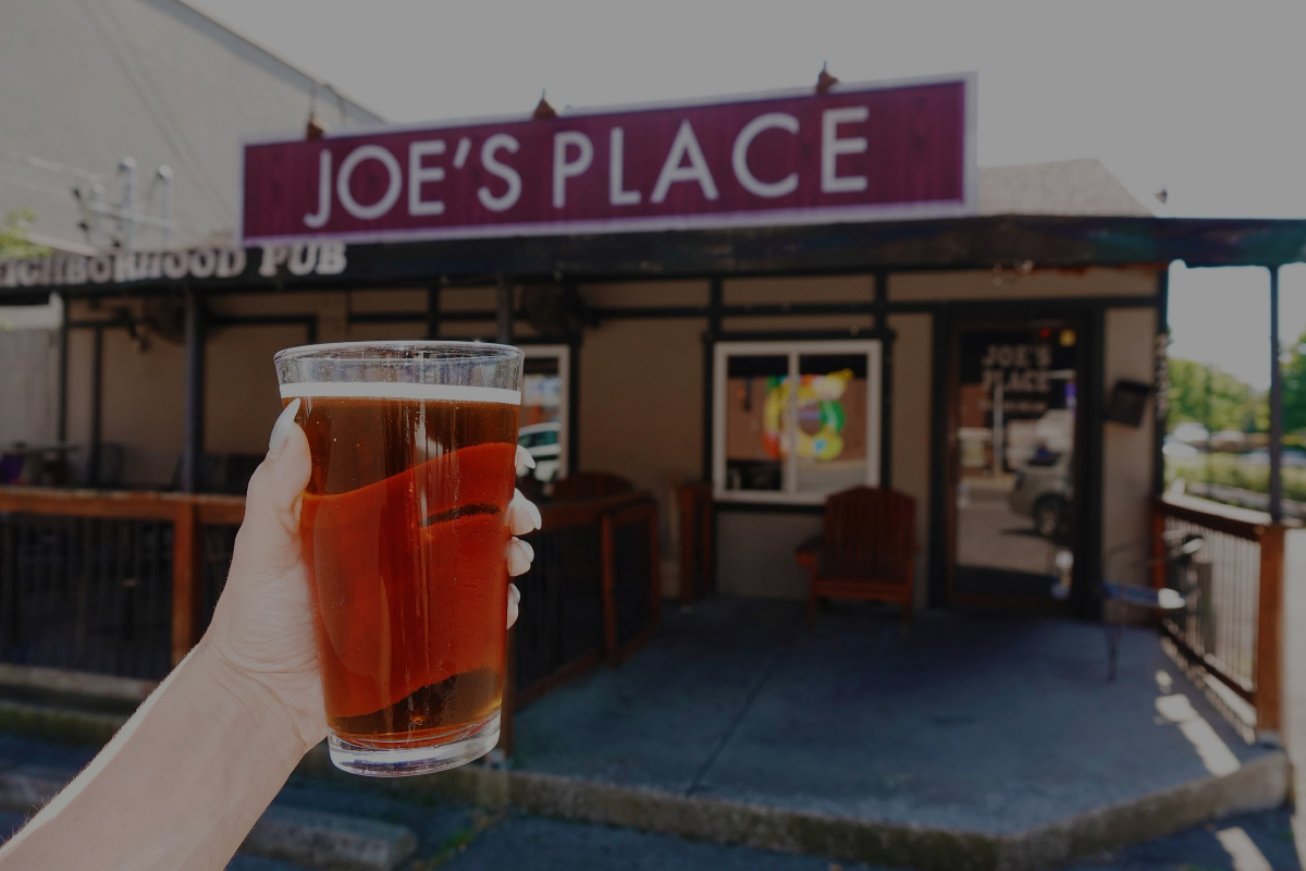 Joe's Place exterior and drink in hand