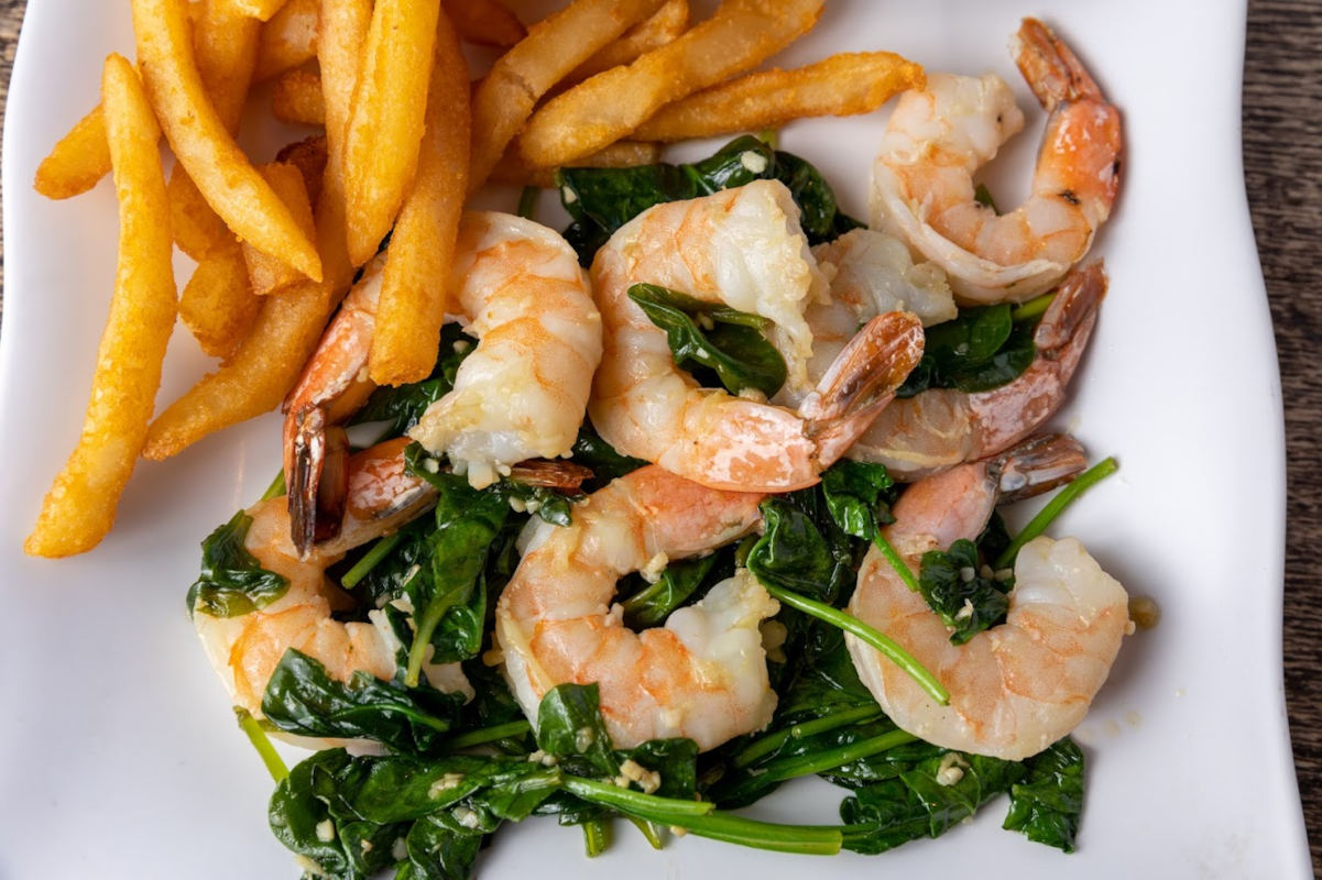 Shrimp dish served with fries