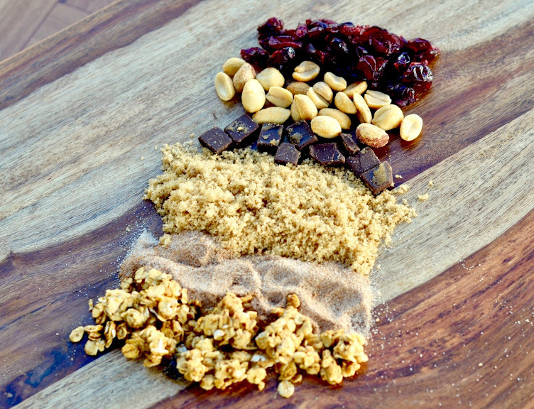 Various ingredients for Gourmet cookies, including peanuts, raisings, and more