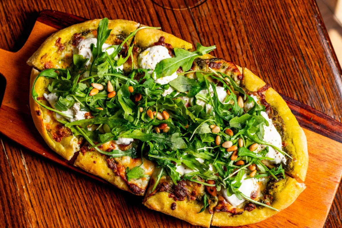 Flat bread with cheese and arugula