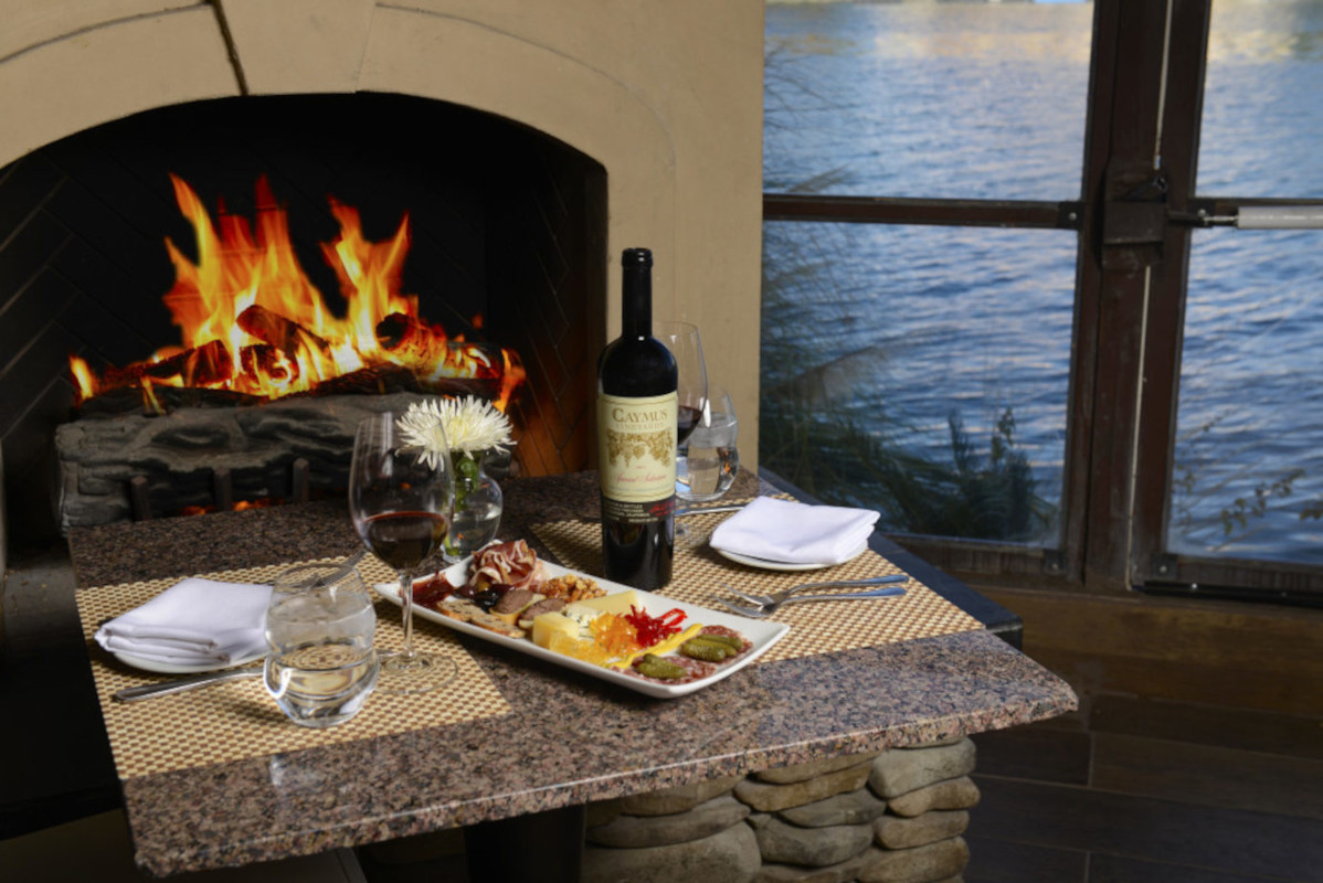 Caymus wine by the fireplace