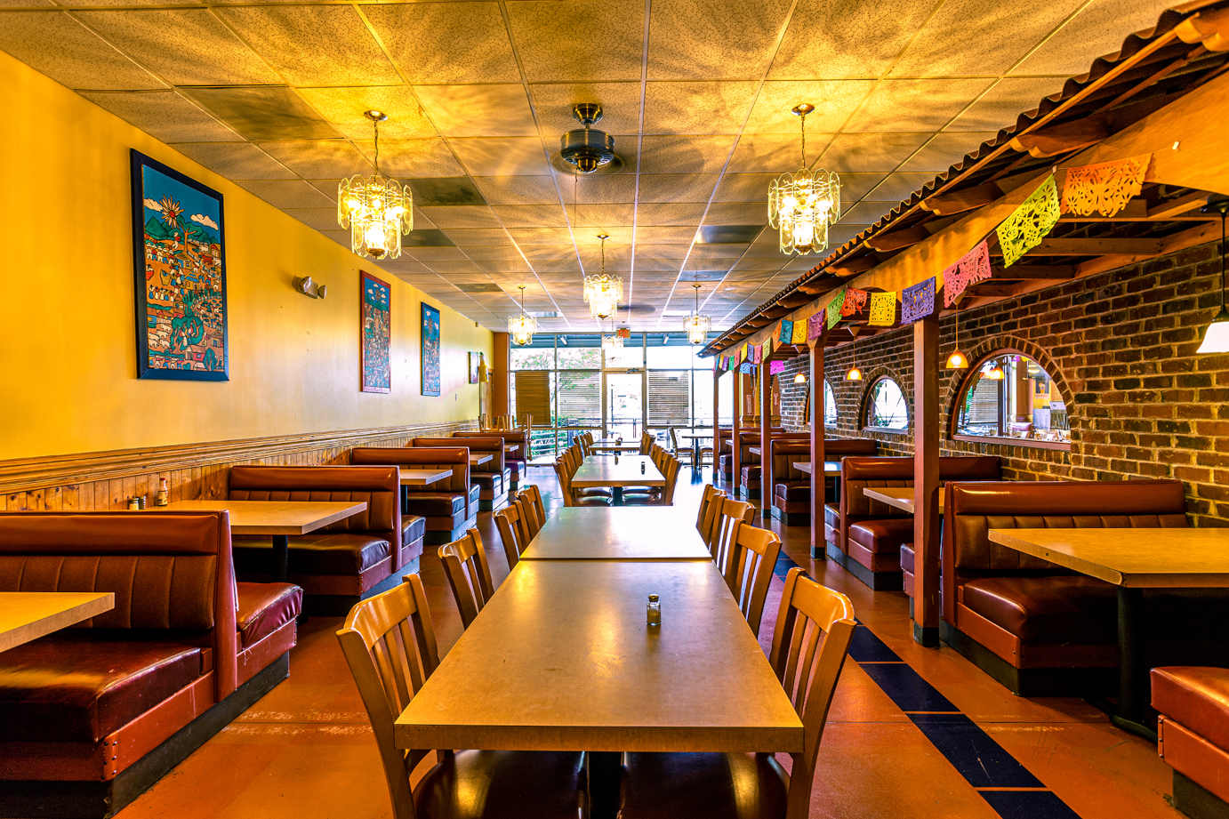 Interior, dining booths and tables with chairs