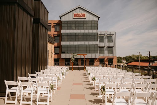 Rooftop wedding ceremony seating outside venue building
