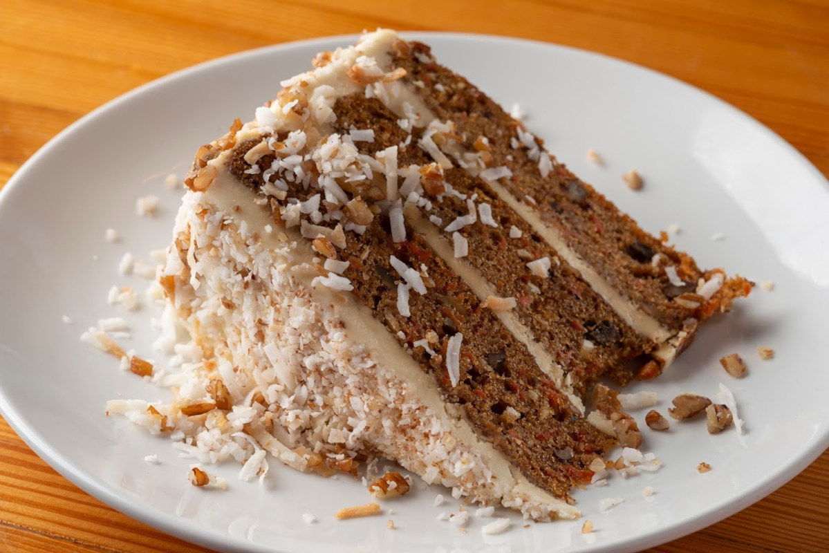 Cake with carrots, pecan, pineapple, and coconut combine