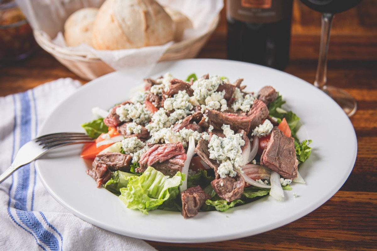 Grilled sliced meat and salad