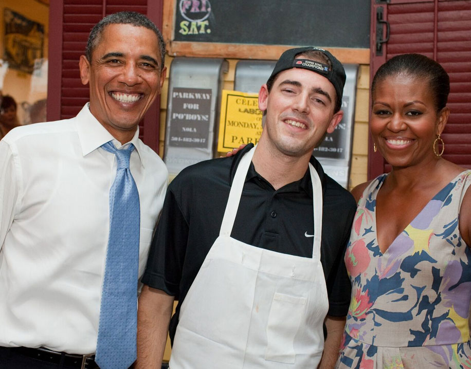 Picture of staff member with Barack and Michelle Obama