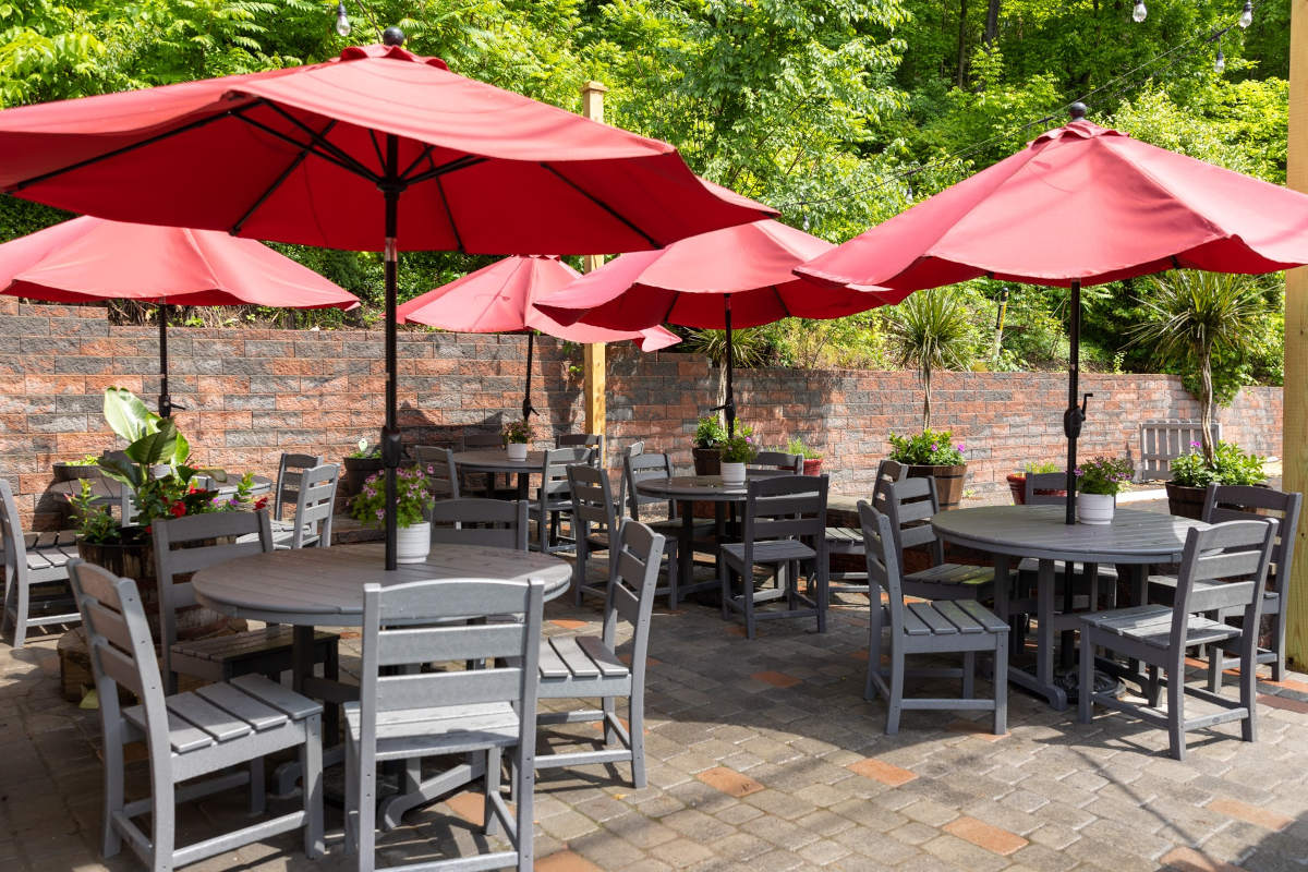Patio tables and seating with parasols