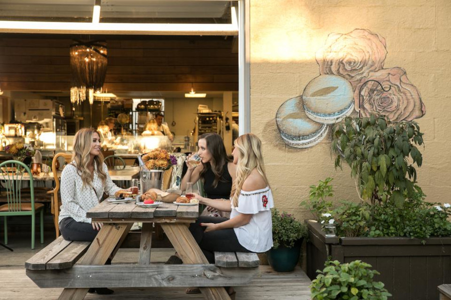 Women enjoying brunch outdoors at Gallery Pastry Shop in Indianapolis