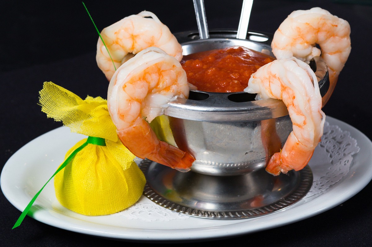 Shrimp in a sauce on a plate.