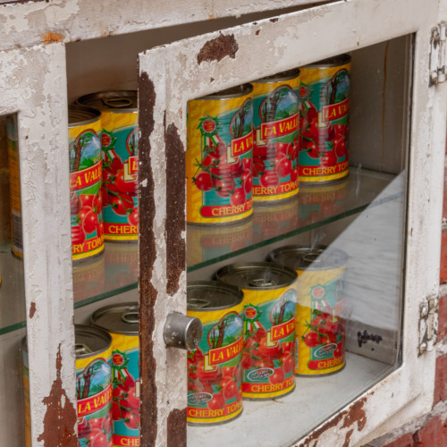 Canned tomatoes in a hutch