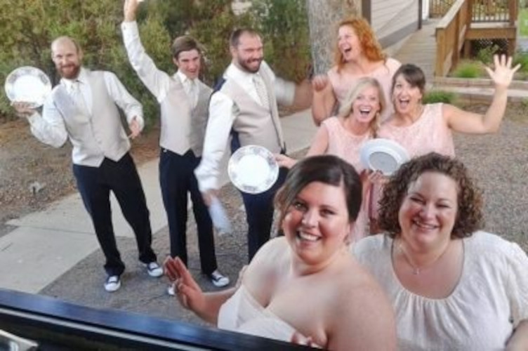Bridesmaids and groomsmen waiting in a line at the foodtruck