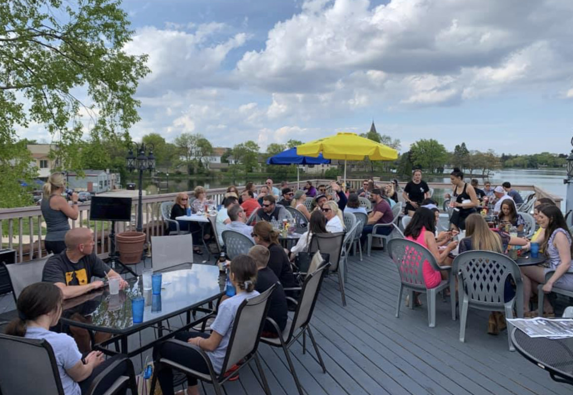 Rooftop patio area, tables full