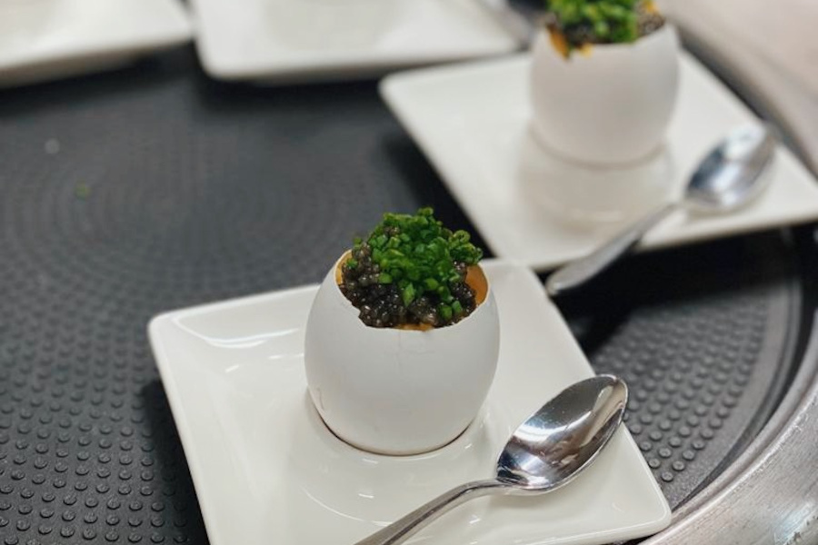 Eggs with vegetables and caviar