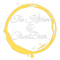 The Kitchen at Stonebrier logo scroll