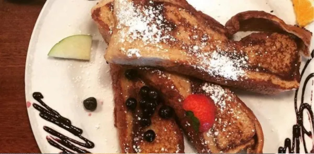 French toast with berries tossed on top