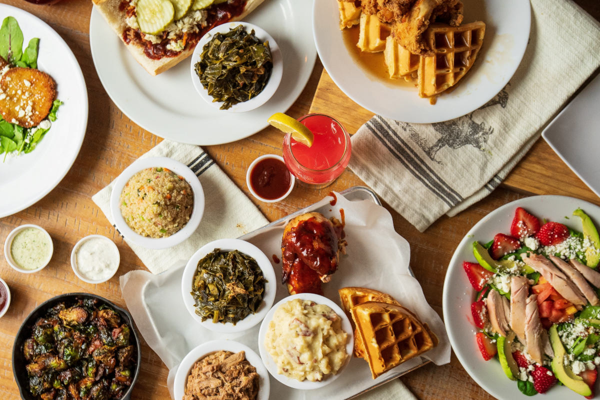 Served food and drinks on the table, top view