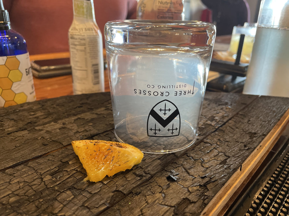 Interior, an upturned glass with the distillery's logo print