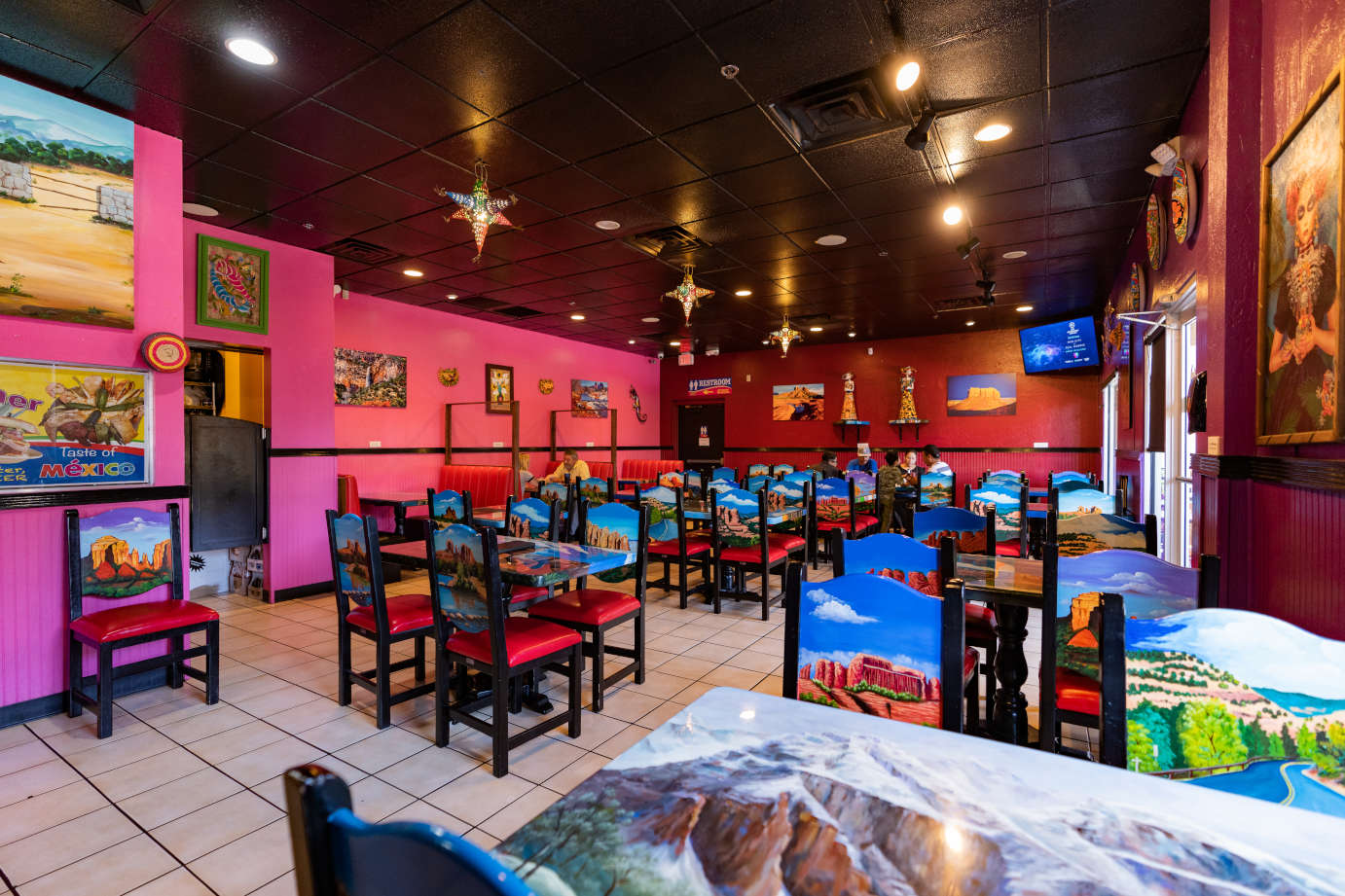 Interior, dining area with colorful prints on seating and tables