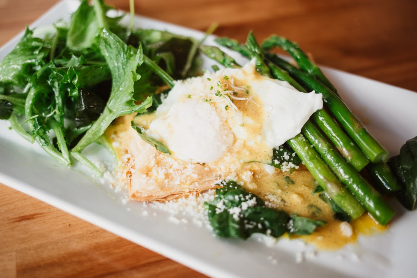 Puff Pastry Benedict with green salad and asparagus