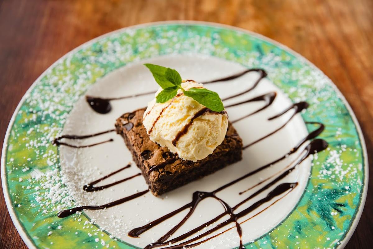 Brownie cake with a ball of ice cream