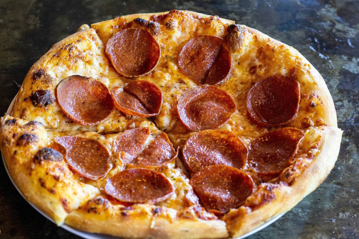 Pizza with extra sausage