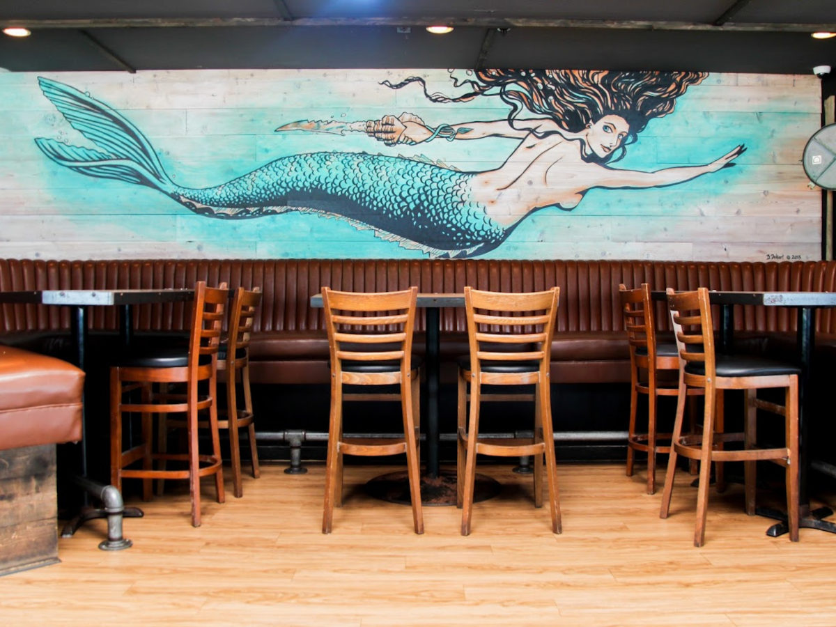 Mural of mermaid on wall