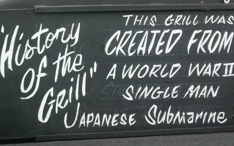 Writing that says - History of the Grill