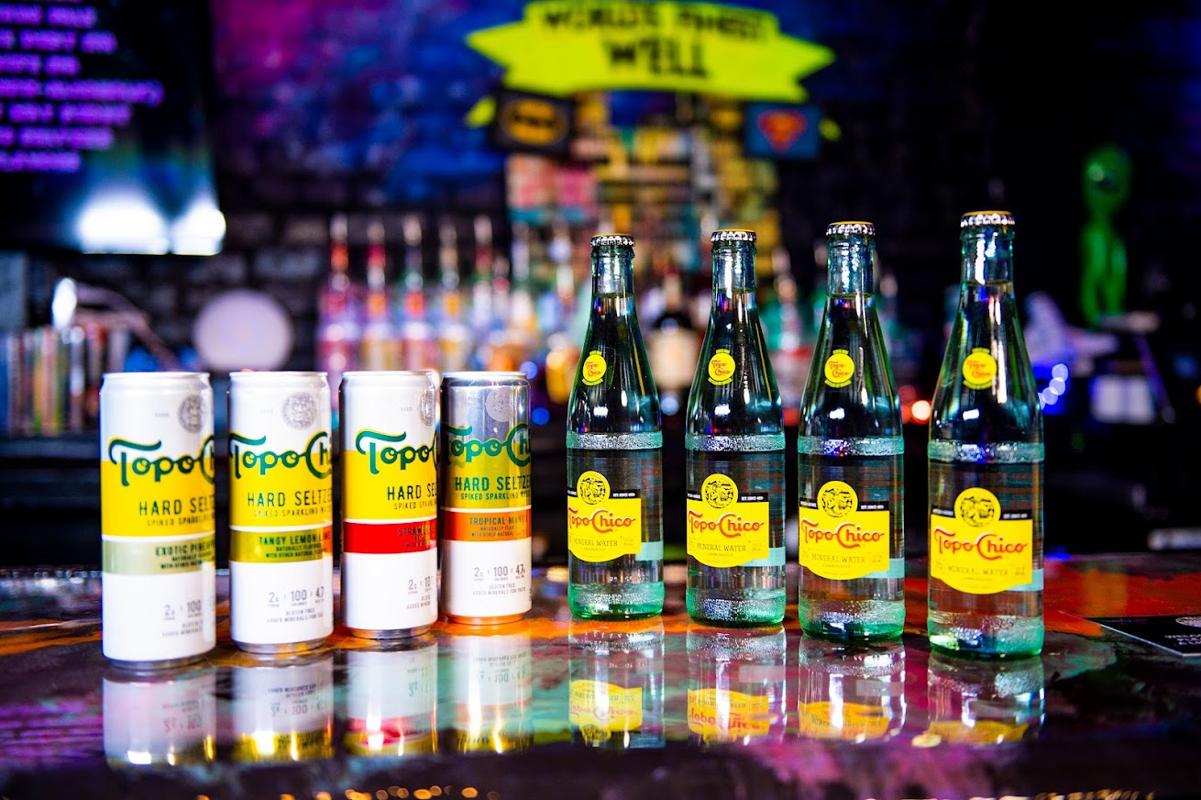 Cans and bottles of Topo Chico sparkling mineral water